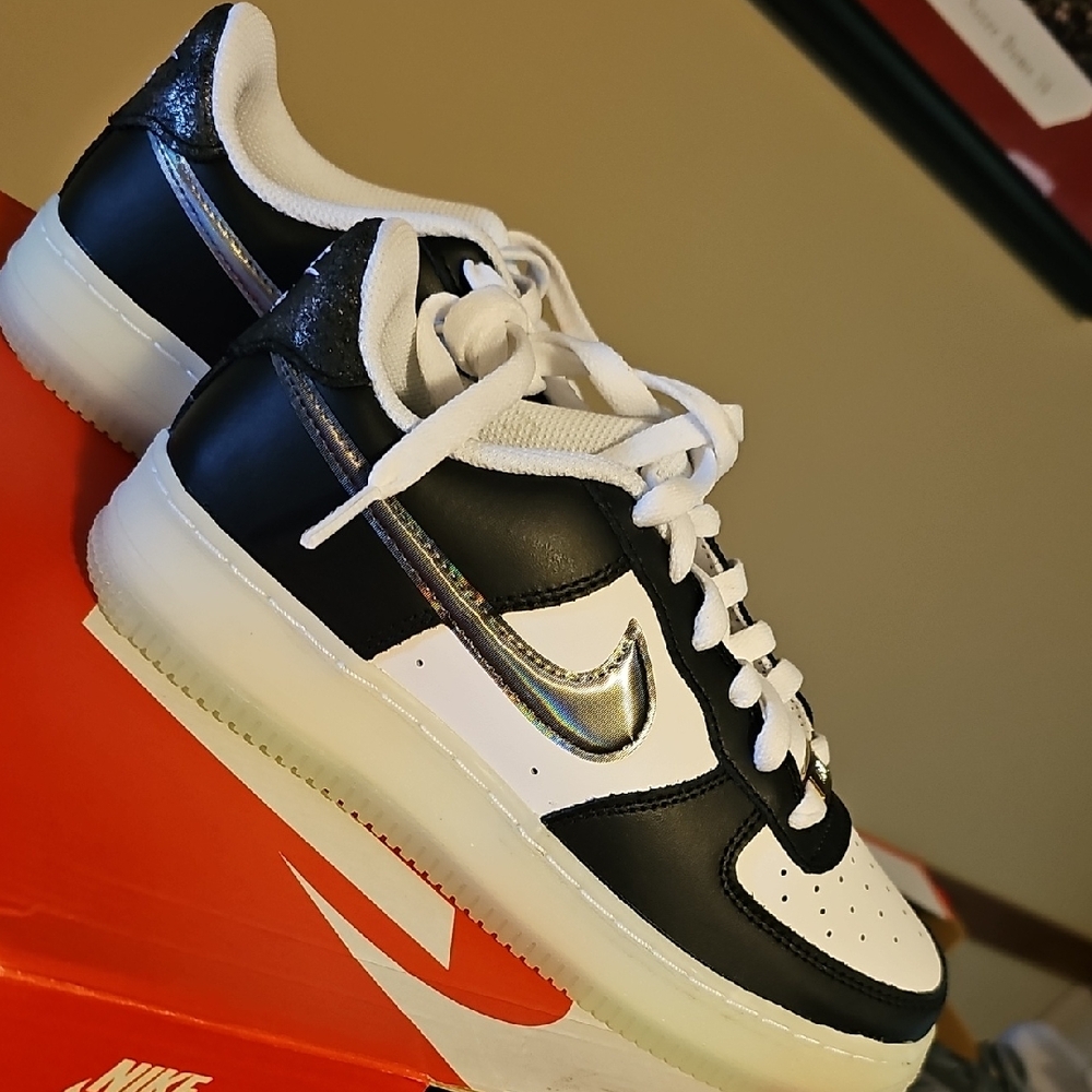 Nike Kids Black and White Sneakers with Silver Accents. GLOW IN THE DARK SOLES